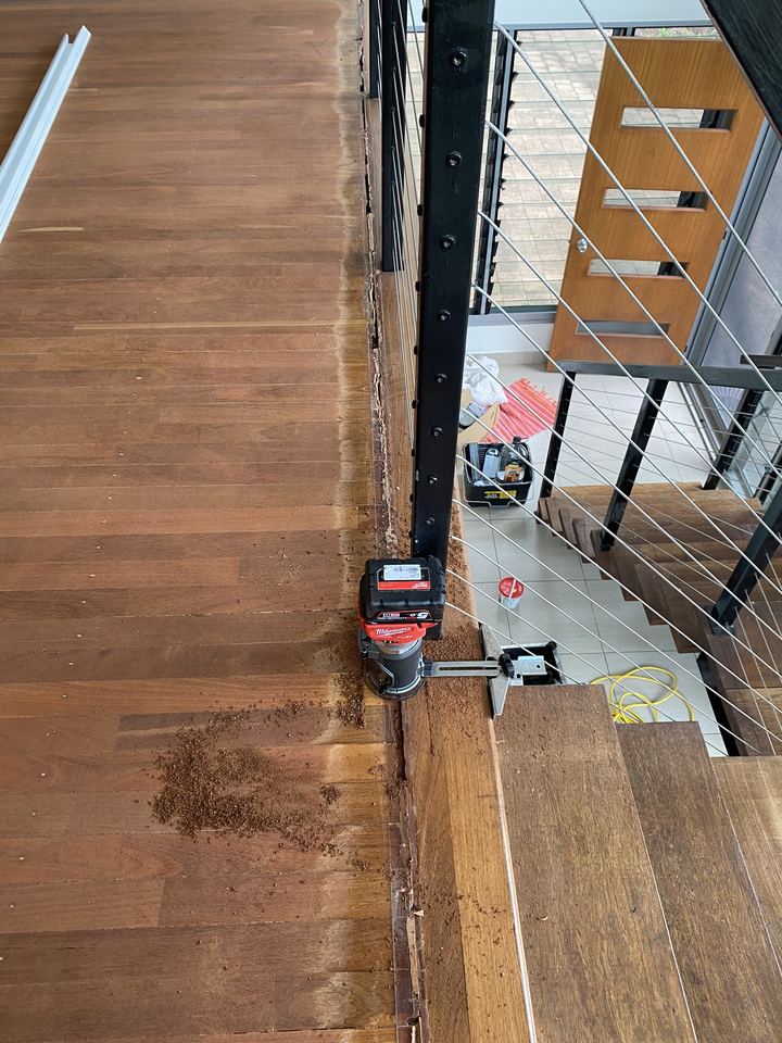 Timber landing during the job, with equipment on the floor.
