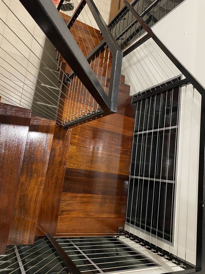 Polished timber stairs and landing seen from above.